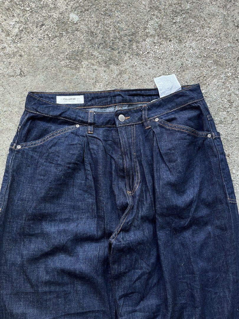 Pull&Bear Dark Blue Wide Leg Denim Jeans EUR 40 (Category: Jeans) located in Manila. Submitted by thrifttika (Listing ID 1469445941, Image 1). Description: - Brand: Pull&Bear - Style: Wide leg fit with front pleats and straight hem - Color: Dark blue / Clean indigo wash with contrast stitching - Size: EUR 40, USA 8, MEX 30 - Details: Back patch pockets, belt loops, standard button and zip fly closure - Condition: Excellent.