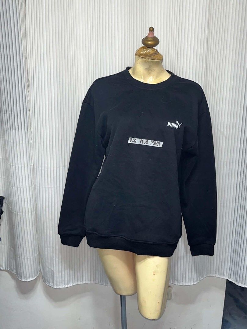 Puma Black Crewneck Sweatshirt (Category: Coats, Jackets and Outerwear) located in General Trias. Submitted by crissy9053136 (Listing ID 1469444863, Image 1). Description: - Brand: Puma - Style: Crewneck sweatshirt - Color: Black with small white logo on chest - Fit: Relaxed fit with long sleeves - Details: Ribbed cuffs and hem - Versatility: Easy to style with jeans or joggers - Condition: Excellent pre-loved condition - SF via J&T or GogoXpress