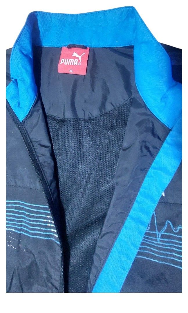 Puma full-zip windbraker (Category: Coats, Jackets and Outerwear) located in Manila. Submitted by undothriftshop (Listing ID 1469512954, Image 3). Description: PUMA lightweight full-zip windbreaker jacket with side pocket size XL on Tag good conditiona (no pinholl, Stain Etc) zippe4 working properly color rate 9.5/10 selling price : 550.