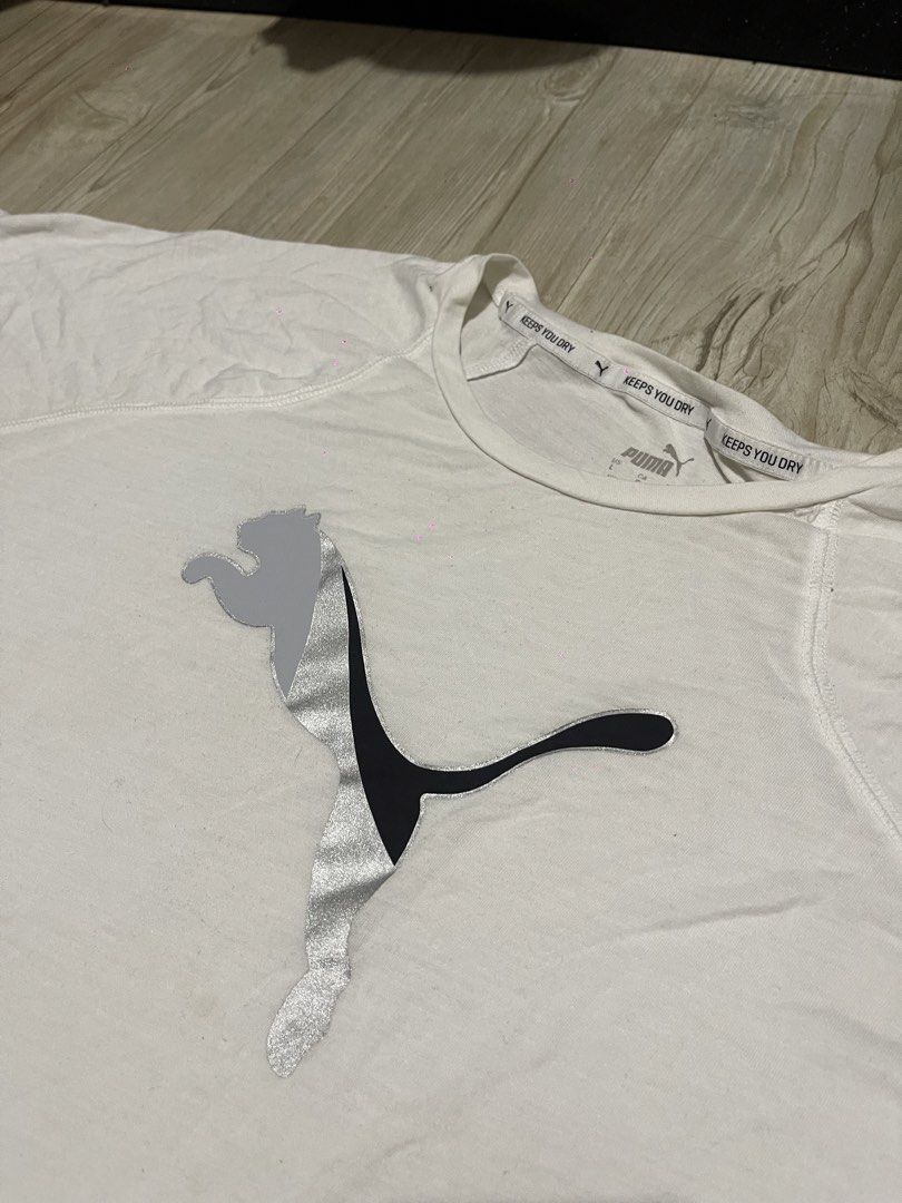 Puma Graphic T-Shirt - White Athletic Tee (Category: Activewear) located in Baguio. Submitted by find_found001 (Listing ID 1469545699, Image 2). Description: Brand: Puma · Style: Athletic t-shirt · Color: White · Features: Large chest graphic, crew neck, short sleeves..