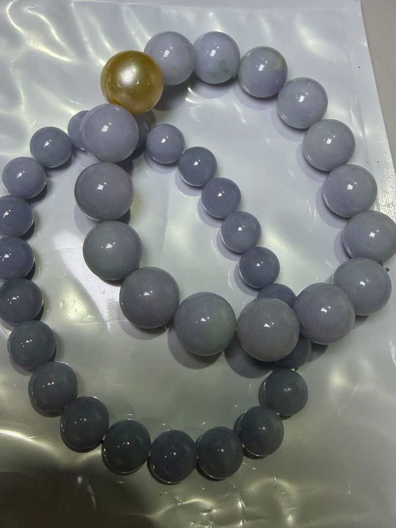 purple jade (Category: Bracelets) located in Mandaluyong City. Submitted by leo7112 (Listing ID 1469527392, Image 1). Description: purple jade 100% legit one with cert i lost the other one bigger mm was diy'd with legit south sea pearl champagne color with fish bites bigger 8500 smaller 9500 (more purplish).