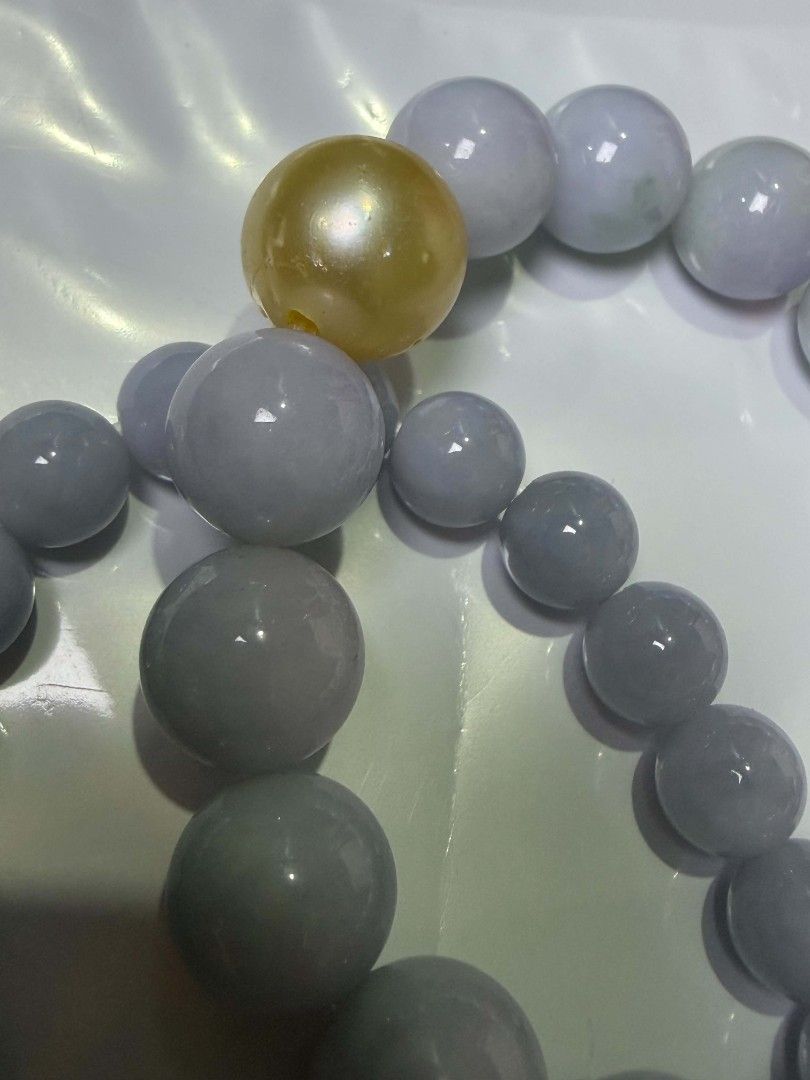 purple jade (Category: Bracelets) located in Mandaluyong City. Submitted by leo7112 (Listing ID 1469527392, Image 2). Description: purple jade 100% legit one with cert i lost the other one bigger mm was diy'd with legit south sea pearl champagne color with fish bites bigger 8500 smaller 9500 (more purplish).