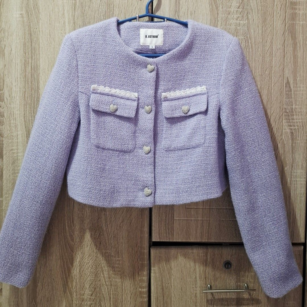 Purple Tweed Cropped Jacket (Category: Coats, Jackets and Outerwear) located in General Trias. Submitted by swiftearth-2ba2 (Listing ID 1469554686, Image 1). Description: Lilac Purple Tweed Jacket (Size S) Features a chic round neckline, pearl heart button-up front, and crochet lace-trimmed chest pockets with matching buttons..
