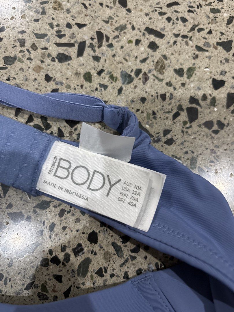 Push Up Bra Size 32A (Category: Undergarments & Loungewear) located in Manila. Submitted by everythingwlove (Listing ID 1469481607, Image 2). Description: - Brand: Cotton On Body - Color: Blue - Size: AUS 10A / USA 32A / EUR 70A / BRZ 40A - Support: Underwire support with smooth cups - Features: Adjustable straps and back hook-and-eye closure - Origin: Made in Indonesia - Details: Fabric care tag attached inside the back band.
