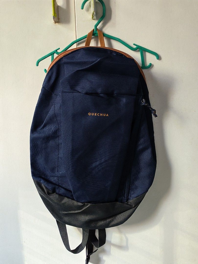 Quechua NH100 10L Hiking Backpack 350 for 2 (Category: Backpacks) located in Mandaluyong City. Submitted by ARVR18 (Listing ID 1469397170, Image 2). Description: - Brand: Quechua NH100 - Capacity: 10L (Tag attached) - Color: Dark purple with contrast zippers And Blue - Ideal for: Daily commutes, school, or short day trips - Features: Adjustable shoulder straps, lightweight material, and a convenient vertical front zip pocket - Condition: Brand ne