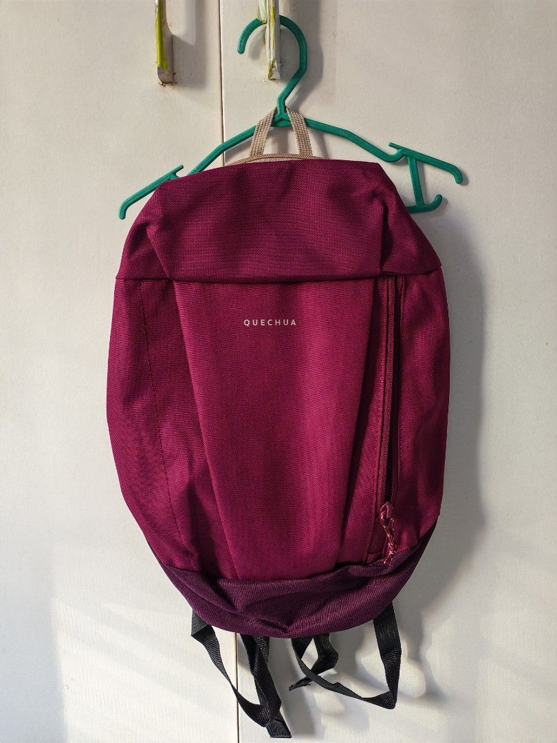 Quechua NH100 10L Hiking Backpack 350 for 2 (Category: Backpacks) located in Mandaluyong City. Submitted by ARVR18 (Listing ID 1469397170, Image 1). Description: - Brand: Quechua NH100 - Capacity: 10L (Tag attached) - Color: Dark purple with contrast zippers And Blue - Ideal for: Daily commutes, school, or short day trips - Features: Adjustable shoulder straps, lightweight material, and a convenient vertical front zip pocket - Condition: Brand ne