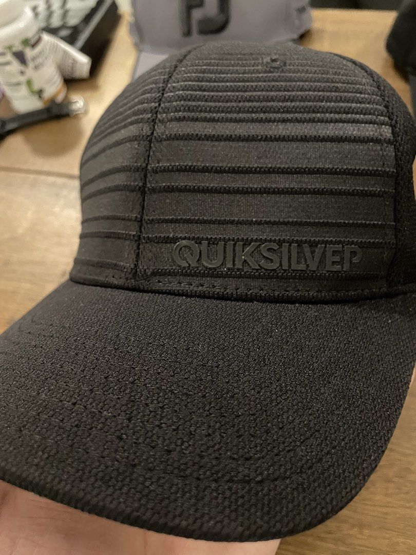 Quiksilver Flexfit Hat Black Size S/M (Category: Caps & Hats) located in Angeles City. Submitted by binostuff (Listing ID 1469515193, Image 3). Description: Selling my Quiksilver black cap. Details: * Color: Black * Textured fabric with ribbed design * Raised Quiksilver logo * Curved brim * Comfortable for casual or outdoor wear Condition: Pre-loved, with normal signs of use. Note: Minor wear/damage on the letter “R” of the Quiksilver logo (see p