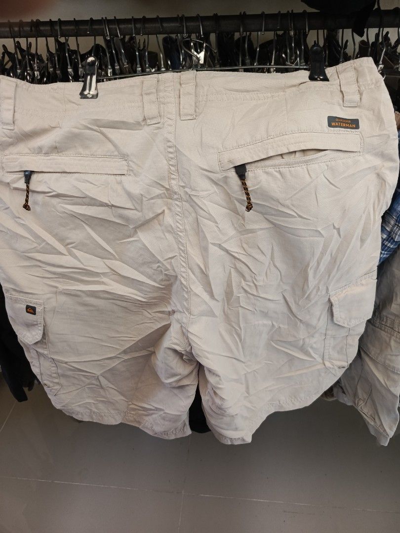 Quiksilver Waterman Collection Cargo Shorts (Category: Shorts) located in Cabatuan. Submitted by penthegreat (Listing ID 1469431607, Image 2). Description: Size 33 on tag Quiksilver Waterman Collection cargo shorts in beige. Multiple utility pockets including zippered back pockets with pull cords. Durable button closure and belt loops. Casual outdoor style..