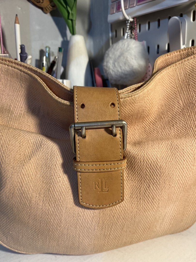 Ralph Lauren Beige Canvas Hobo Bag (Category: Shoulder Bags) located in Muntinlupa City. Submitted by pique.unique (Listing ID 1469535498, Image 3). Description: - Vintage Hobo - Authenticity Guaranteed - Brand: Ralph Lauren - Style: Hobo bag with single shoulder strap - Material: Beige canvas with textured herringbone pattern & brown leather trim - Details: Contrast white stitching, metal hardware stamped with brand name, front flap closure with