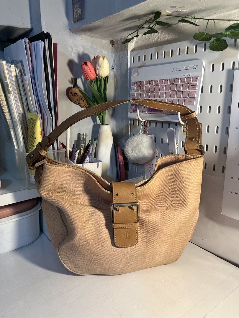Ralph Lauren Beige Canvas Hobo Bag (Category: Shoulder Bags) located in Muntinlupa City. Submitted by pique.unique (Listing ID 1469535498, Image 1). Description: - Vintage Hobo - Authenticity Guaranteed - Brand: Ralph Lauren - Style: Hobo bag with single shoulder strap - Material: Beige canvas with textured herringbone pattern & brown leather trim - Details: Contrast white stitching, metal hardware stamped with brand name, front flap closure with