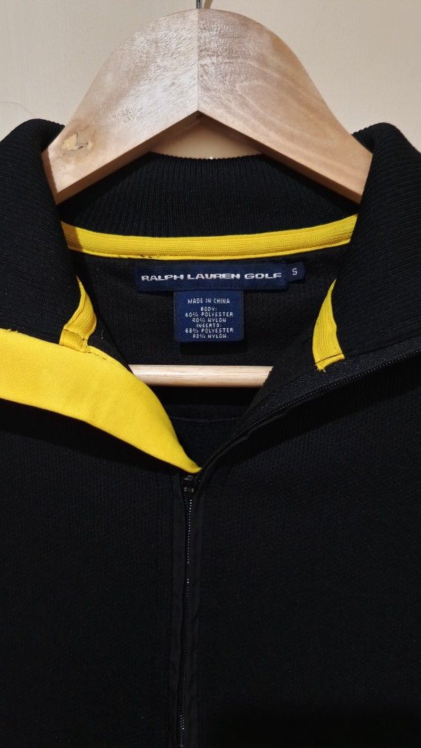 Ralph Lauren Golf Black Half-Zip Sweatshirt (Category: Coats, Jackets and Outerwear) located in Manila. Submitted by reysfindsph (Listing ID 1469522072, Image 2). Description: - Brand: Ralph Lauren Golf - Style: Half-zip sweatshirt / pullover - Color: Black with yellow inner collar accent - Size: Small (S) - Design: Bold Ralph Lauren branding down the right sleeve, ribbed cuffs and hem, quarter-zip neck - Material: Body - 60% Polyester, 40% Nylon