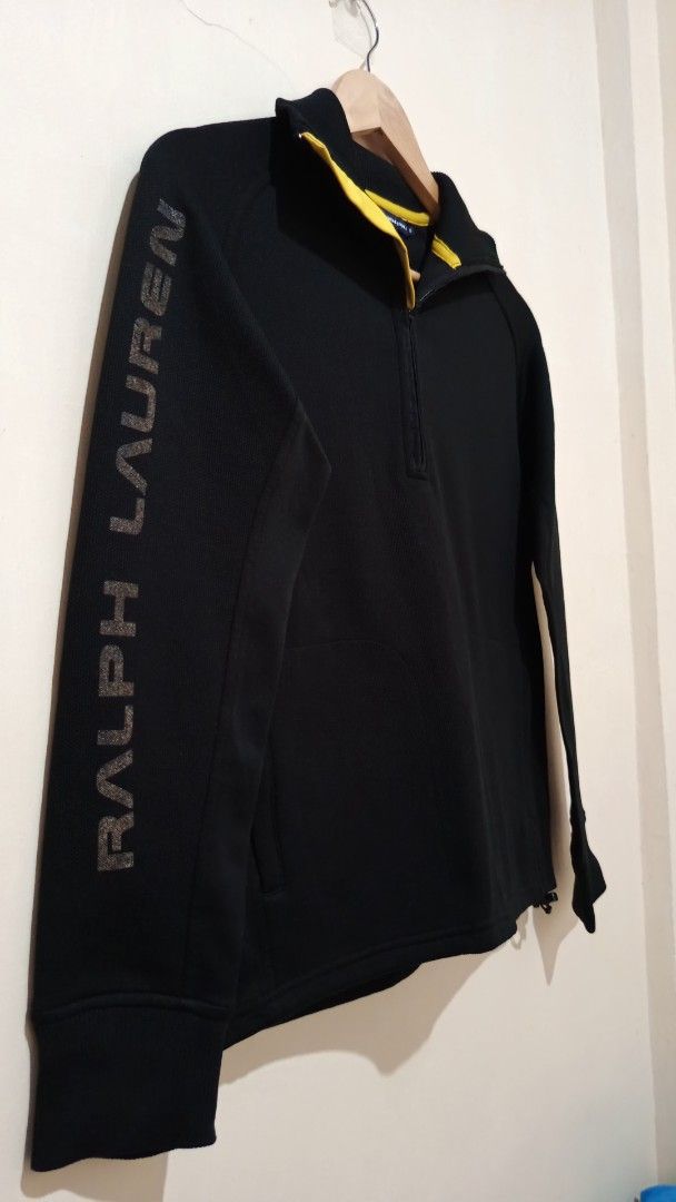 Ralph Lauren Golf Black Half-Zip Sweatshirt (Category: Coats, Jackets and Outerwear) located in Manila. Submitted by reysfindsph (Listing ID 1469522072, Image 3). Description: - Brand: Ralph Lauren Golf - Style: Half-zip sweatshirt / pullover - Color: Black with yellow inner collar accent - Size: Small (S) - Design: Bold Ralph Lauren branding down the right sleeve, ribbed cuffs and hem, quarter-zip neck - Material: Body - 60% Polyester, 40% Nylon