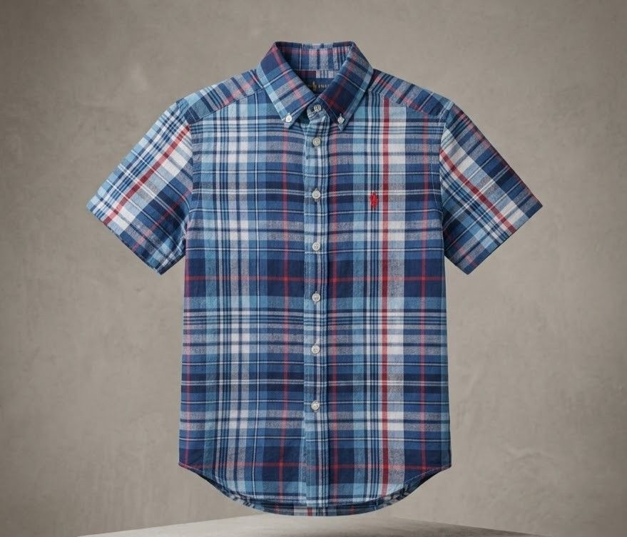 Ralph Lauren Plaid Button Down Shirt Size S (8) (Category: Tshirts & Polo Shirts ) located in Caba. Submitted by valerie_18947 (Listing ID 1469490377, Image 1). Description: Polo Ralph Lauren Boys Plaid Button-Down Shirt (Size S / 8 Years) Overview Add a classic touch of preppy luxury to your boy's wardrobe with this authentic Polo Ralph Lauren short-sleeve shirt. Featuring a vibrant multi-colored blue, white, and red tartan plaid pattern, this l