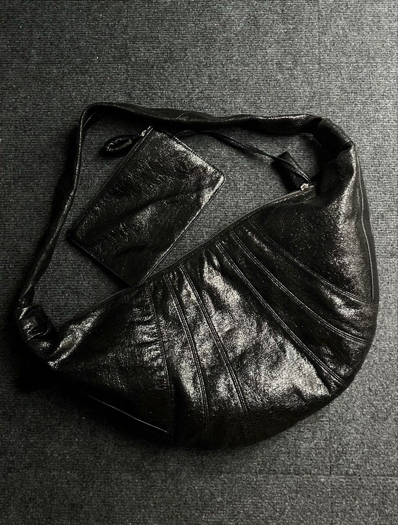 Rare Lemaire Large Croissant Bag (Category: Luxury Bags & Wallets) located in Muntinlupa City. Submitted by enchantiquebyygtrends (Listing ID 1469531179, Image 2). Description: RARE L*MAIRE LARGE CROISSANT BAG Excellent preloved condition. Spacious, stylish, and effortlessly chic. Perfect for everyday use, airport looks, or travel. Rare find! Don’t miss out — DM now to make it yours! 📩.