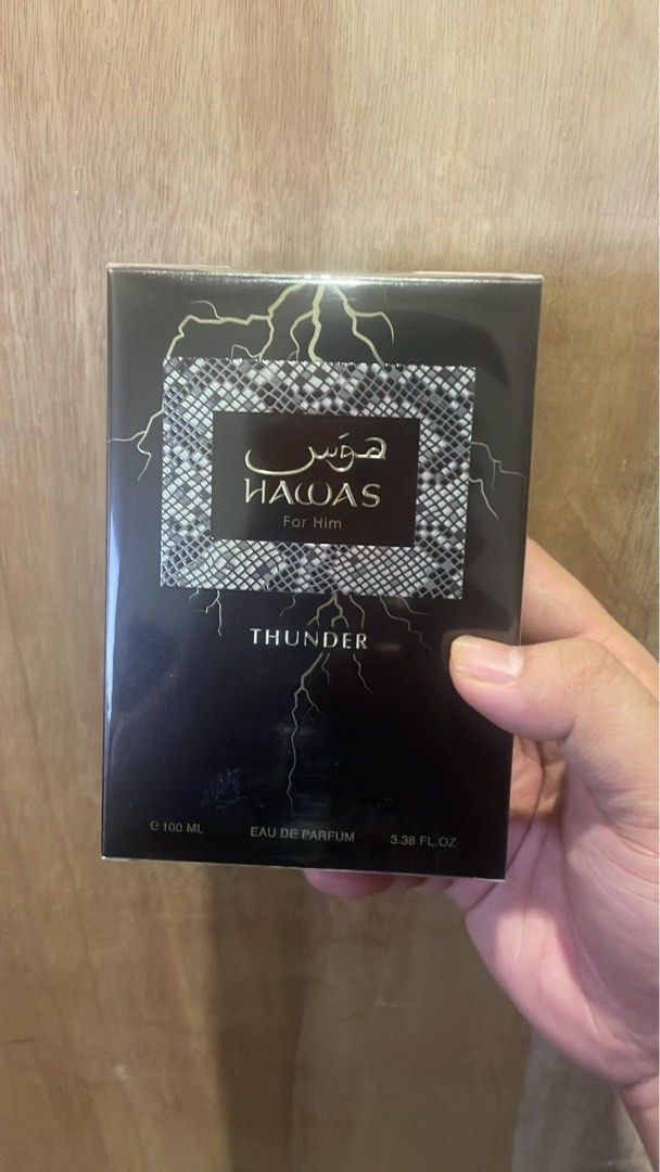 Rasasi Hawas Thunder For Him (Category: Fragrance & Deodorants) located in Quezon City. Submitted by brave_dowayne (Listing ID 1469539644, Image 2). Description: - Fragrance: Rasasi Hawas Thunder for Men - Scent Profile: Citrus, fresh spicy, woody, fruity, fresh, warm spicy, green, aromatic, and amber - Bottle Design: Distinct lightning bolt design with a sleek dark cap - Status: Highly popular and in-demand fragrance - Condition: Brand new and a
