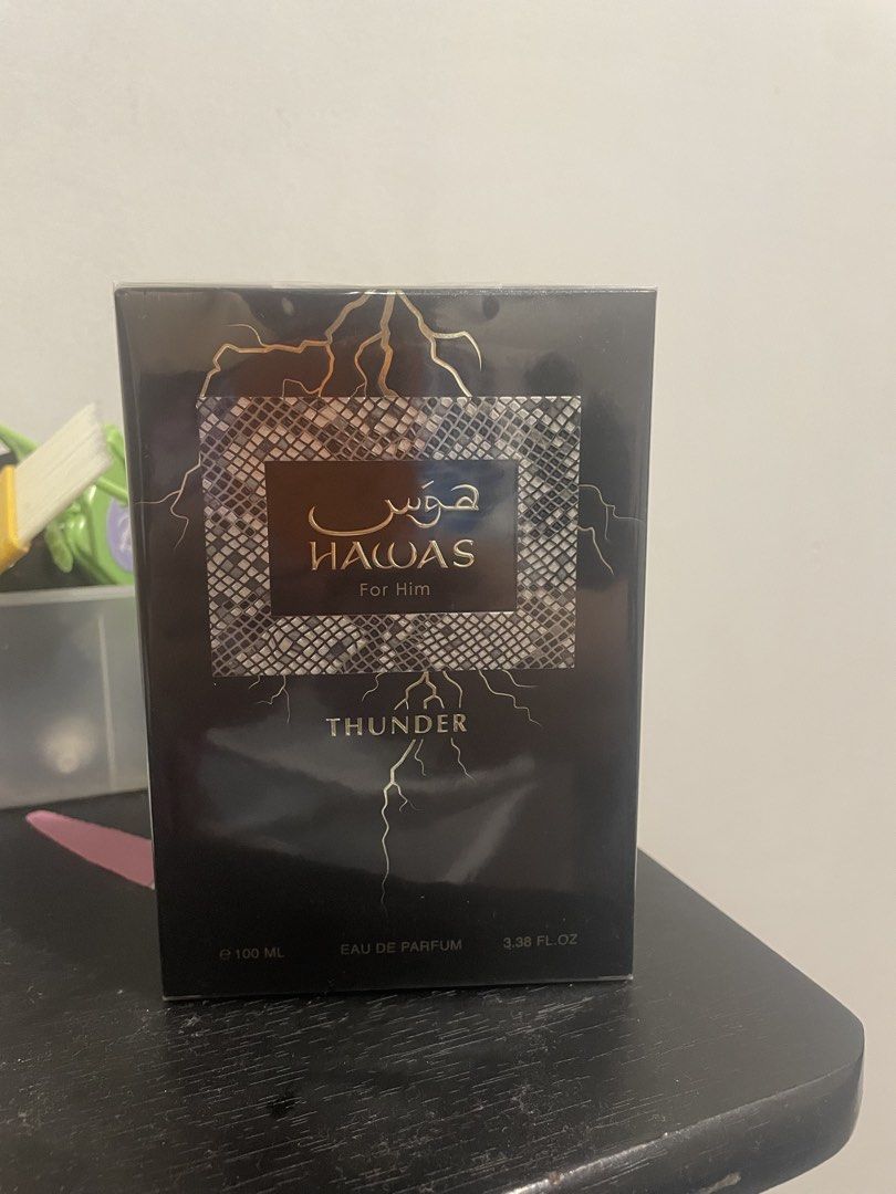 Rasasi Hawas Thunder For Him (Category: Fragrance & Deodorants) located in Quezon City. Submitted by brave_dowayne (Listing ID 1469539644, Image 3). Description: - Fragrance: Rasasi Hawas Thunder for Men - Scent Profile: Citrus, fresh spicy, woody, fruity, fresh, warm spicy, green, aromatic, and amber - Bottle Design: Distinct lightning bolt design with a sleek dark cap - Status: Highly popular and in-demand fragrance - Condition: Brand new and a