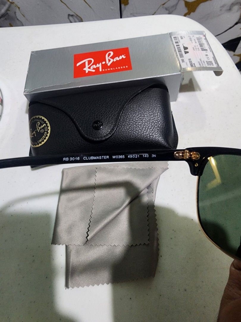 Ray-Ban Clubmaster RB3016 Sunglasses (Category: Sunglasses & Eyewear) located in Pasay City. Submitted by anicoapostol19 (Listing ID 1469432933, Image 2). Description: - Brand: Ray-Ban - Model: Clubmaster RB3016 W0365 - Frame Color: Classic Black & Gold - Lens Color: Green - Size: 49-21-140 - Origin: Made in Italy - Inclusions: Original leather case, cleaning cloth, outer box, and tag - Condition: Brand new / Excellent (Ready to ship).