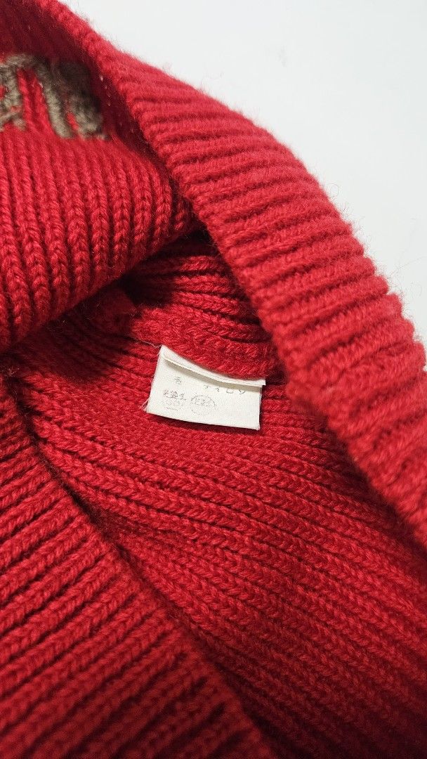 Red Beanie with Embroidered Text (Category: Caps & Hats) located in Alfonso. Submitted by jbcamet (Listing ID 1469516894, Image 3). Description: - Color: Bright red - Texture: All-over ribbed knit - Detail: Grey vertical embroidered lettering on the side - Condition: Brand new/Excellent - Perfect cozy winter essential to keep you warm.