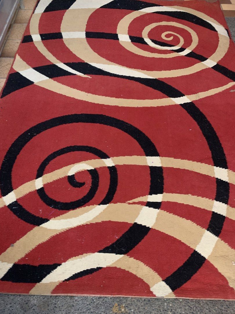 Red Black Cream Swirl Pattern Rug (Category: Carpets, Mats & Flooring) located in Bulacan. Submitted by heartlove_holb (Listing ID 1469421871, Image 1). Description: - Eye-catching spiral and swirl pattern with a bold red background - Modern mix of black, beige, and cream curves - Heavyweight fabric construction that lays flat nicely - Features clean, finished edges all around - Perfect statement piece for living rooms or bedrooms.