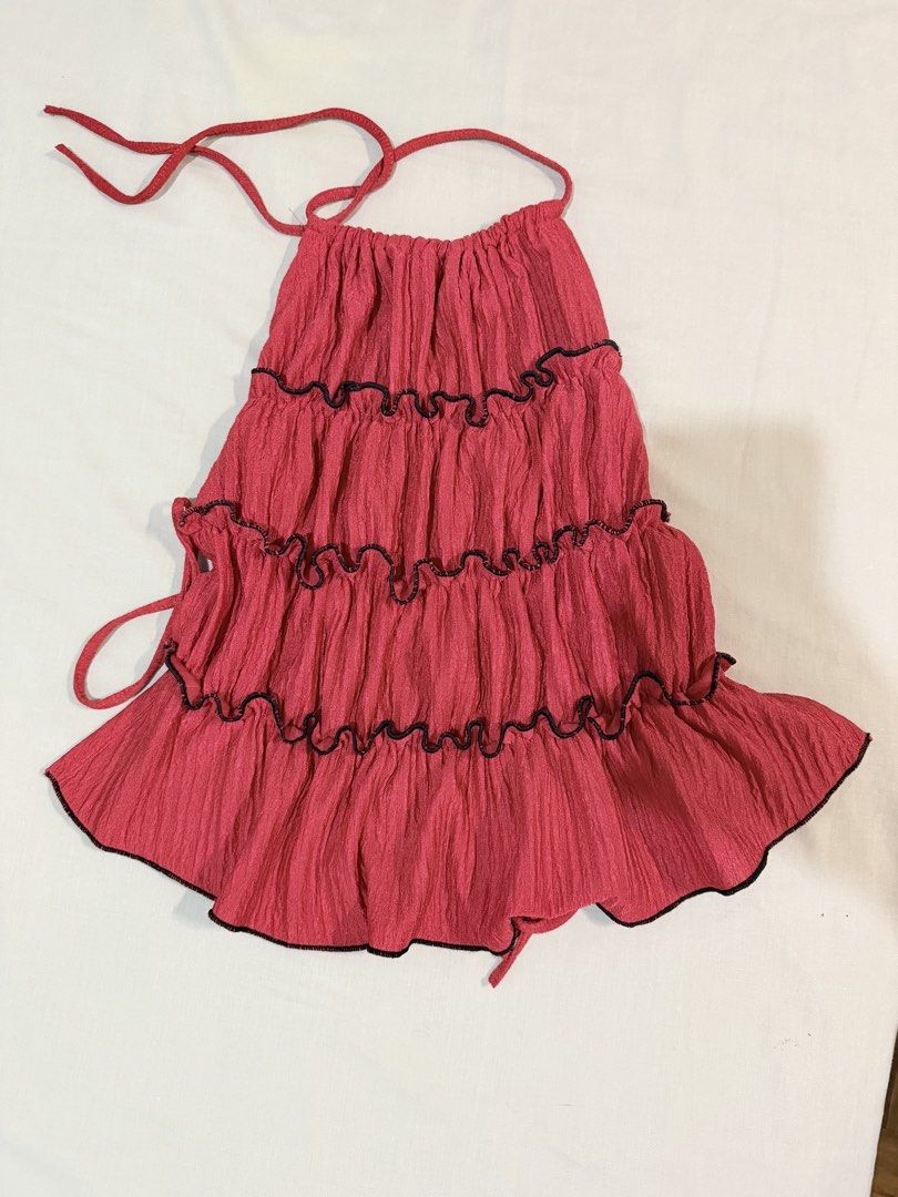 Red black Halter Top Tiered Ruffle Layered Summer backless (Category: Sleeveless) located in Paranaque City. Submitted by hannahking36 (Listing ID 1469540107, Image 1). Description: - Pink halter top with 3 tiered layers - Crinkle texture fabric with stylish black lettuce trim on every tier - Adjustable halter neck ties and back ties for a custom fit - Lightweight and breathable material, ideal for warm weather - Condition: Brand new - Shipping: 