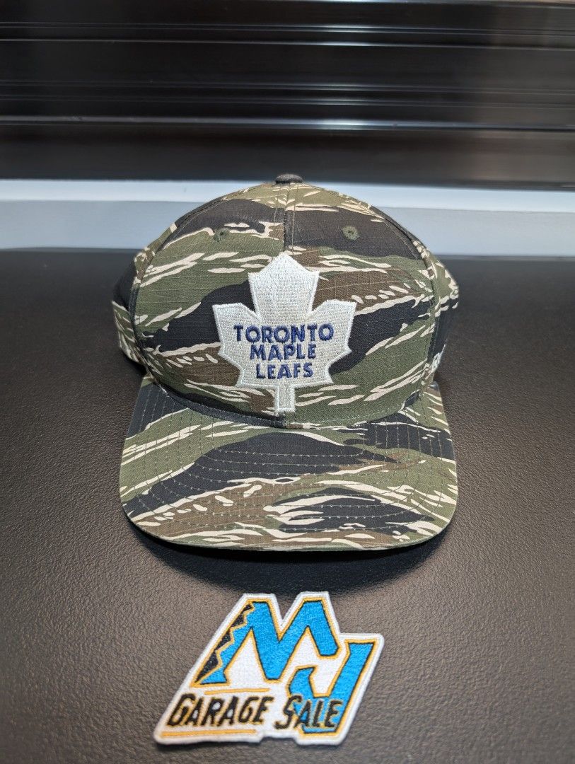 Reebok Toronto Maple Leafs Tiger Camo Snapback Hat (Category: Caps & Hats) located in Santa Maria. Submitted by mjgaragesale (Listing ID 1469503461, Image 1). Description: Reebok Toronto Maple Leafs Tiger Camo Snapback ◉ Conditon: 9.4/10 ◉ Ripstop texture fabric ◉ Big embroidered front logo ◉ From Mid 2000's Era ◉ 100% Legit / Original ◉ Issuse: Small discoloration at left side and crack snapback (Checkout last 2 pics) Can also do meet up around 
