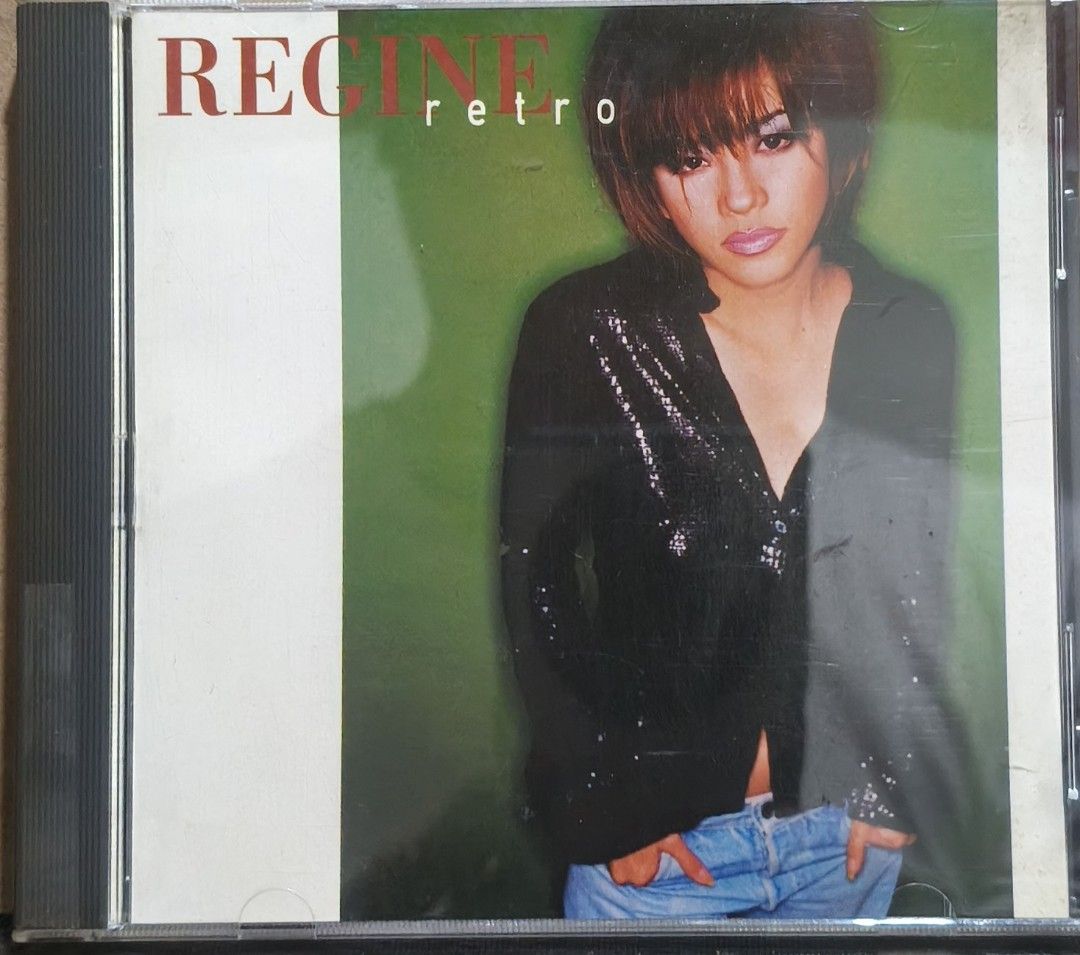 Regine Retro CD Album PolyCosmic Records (Category: CDs & DVDs) located in Manila. Submitted by ruelcabrer77078 (Listing ID 1469555544, Image 1). Description: - Artist & Album: Regine - Retro - Release Year: 1996 - Record Label: PolyCosmic Records - Packaging: Standard jewel case with front cover artwork and back insert sleeve included - Condition Note: Disc has handwritten markings in permanent marker on the surface - Ideal for OPM collectors an
