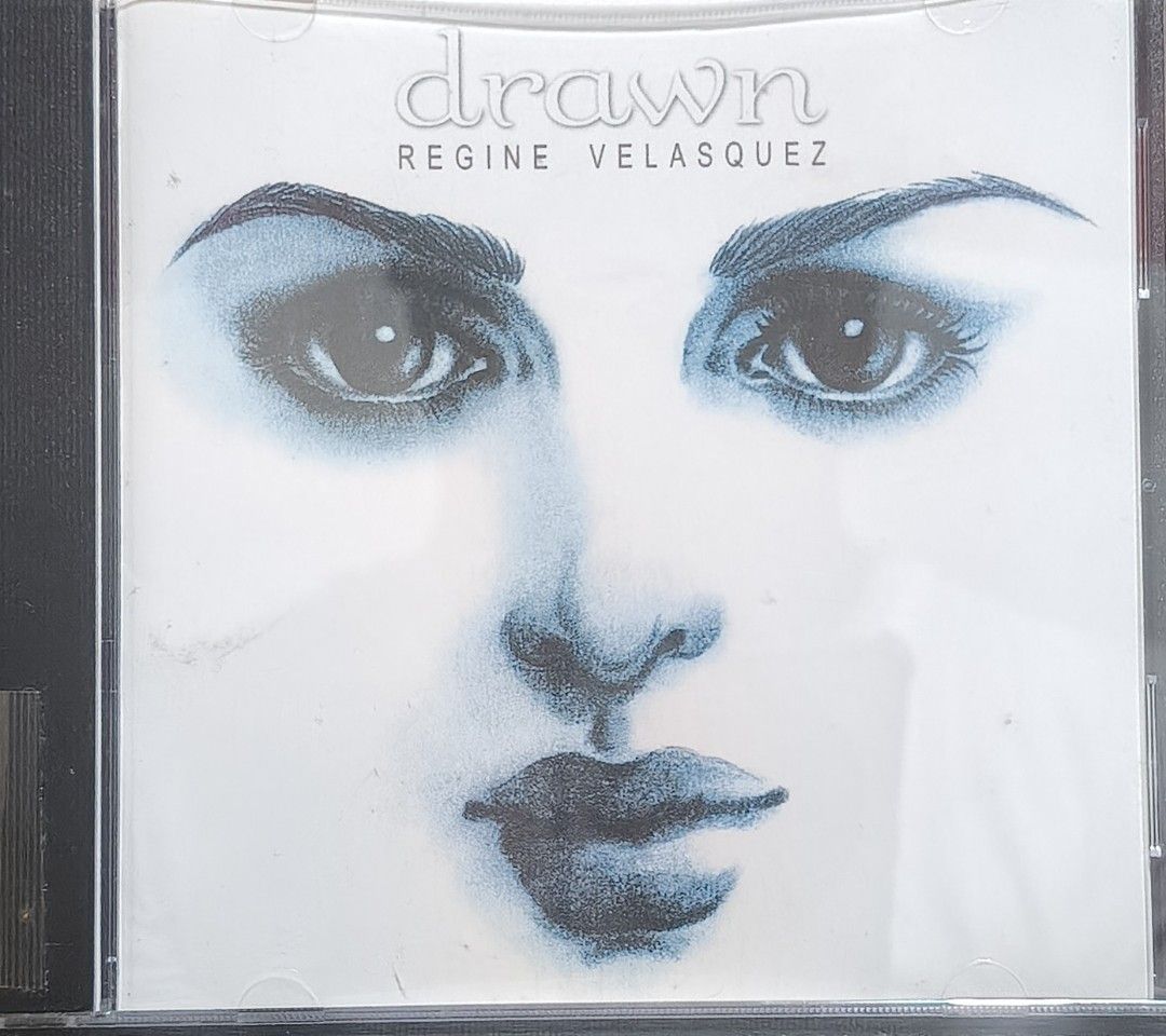 Regine Velasquez - Drawn CD Album (Category: CDs & DVDs) located in Manila. Submitted by ruelcabrer77078 (Listing ID 1469555186, Image 1). Description: - Artist & Title: Regine Velasquez - Drawn - Release Year: 1998 - Label: Viva Records - Includes: Original jewel case - Notable tracks: How Could You Leave, Once In A Lifetime Love, Messin' With My Head, Love Again, and more - Condition note: Back insert features handwritten notes next to song tit