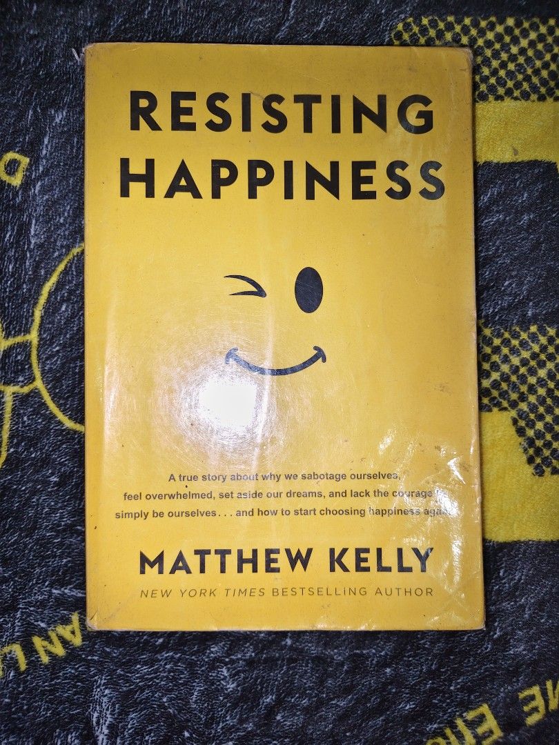 Resisting Happiness by Matthew Kelly (Category: Storybooks) located in Manila. Submitted by engrkkkk (Listing ID 1469413765, Image 1). Description: - Title: Resisting Happiness - Author: Matthew Kelly (New York Times Bestselling Author) - Condition: Collectible/Well Used - Cover: Bright yellowwith a winking smiley face - About the Book: A true story that helps you overcome self-sabotage, overwhelm, and fear to start choosing happiness again..