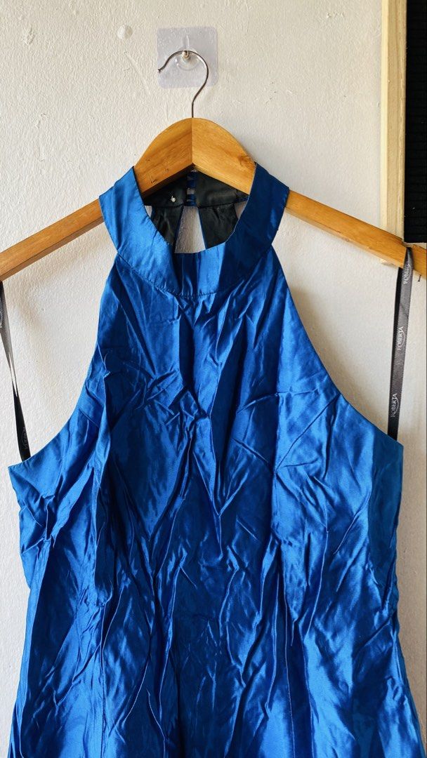 Roberta Blue Halter Neck Gown (Category: Dresses) located in Caloocan City. Submitted by lovemyclothes21 (Listing ID 1469463692, Image 3). Description: - Brand: Roberta - Size: Small - Color: Bright Royal Blue - Style: Halter neckline, sleeveless, open back with button closure and back zipper - Material: 100% Acetate (Shell and Lining) - Lining: Fully lined in contrasting black - Condition: Excellent.