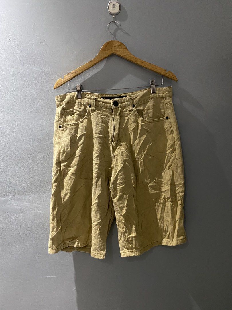 Rocawear Khaki Cargo Shorts (Category: Shorts) located in Bangued. Submitted by koroysthrifts (Listing ID 1469519088, Image 3). Description: 34x23x11.5 Rocawear khaki cargo shorts in a tan shade. Heavy twill fabric construction with multiple utility pockets on the back and sides. Embroidered logo detailing on the back pocket flap and front coin pocket. Button fly closure and branded waistband tag. Solid streetwear staple..