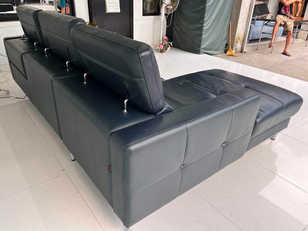 Rodius Navy Blue Leather Sectional Sofa with Recliner (Category: Sofas) located in Manila. Submitted by roveeeeelen_06 (Listing ID 1469571983, Image 3). Description: - Brand/Model: Rodius navy blue leather sectional sofa - Features: Built-in recliner mechanism and comfortable chaise lounge extension - Design: Modern chrome metal legs - Condition: Plush cushioning with standard leather wear - Ideal for: Upgrading your living room space.