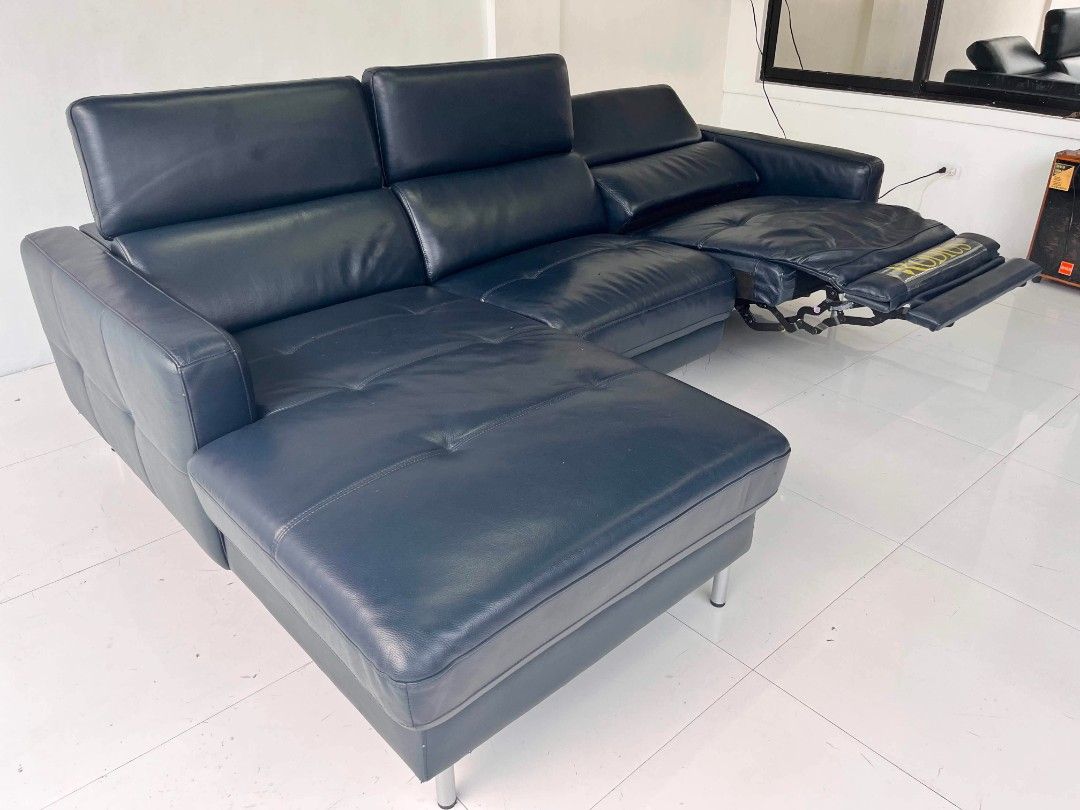 Rodius Navy Blue Leather Sectional Sofa with Recliner (Category: Sofas) located in Manila. Submitted by roveeeeelen_06 (Listing ID 1469571983, Image 1). Description: - Brand/Model: Rodius navy blue leather sectional sofa - Features: Built-in recliner mechanism and comfortable chaise lounge extension - Design: Modern chrome metal legs - Condition: Plush cushioning with standard leather wear - Ideal for: Upgrading your living room space.