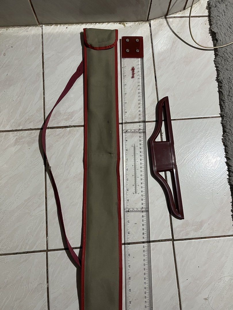 Rotring Drawing Ruler Set with Carrying Case 687-536 (Category: Stationery & School Supplies) located in Manila. Submitted by mae009 (Listing ID 1469512070, Image 3). Description: Price Negotiable if sure buyer - Brand: Rotring (Model 687-536) - Condition: Clean with clear, easy-to-read markings - Inclusions: Long clear ruler, red sliding attachment, and khaki canvas carrying bag with red trim and shoulder strap - Ideal for: Technical drawing, dr