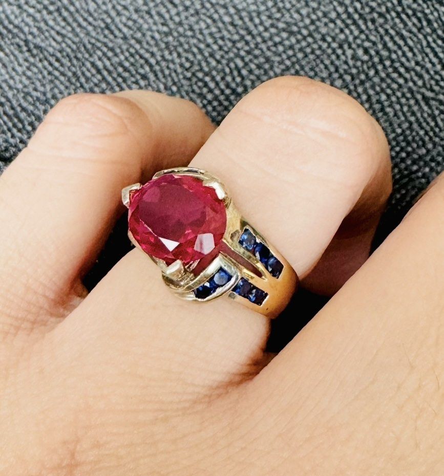 Ruby with Fasceted Blue Sapphire Stones (Category: Rings) located in Cauayan City . Submitted by espiritucj (Listing ID 1469430198, Image 1). Description: Japan Haul Big MM si Ruby stone With markingss- - Gold band cocktail ring - Large oval-cut ruby center - faceted sapphire stones - Hallmarks stamped inside the band - Unique statement piece.