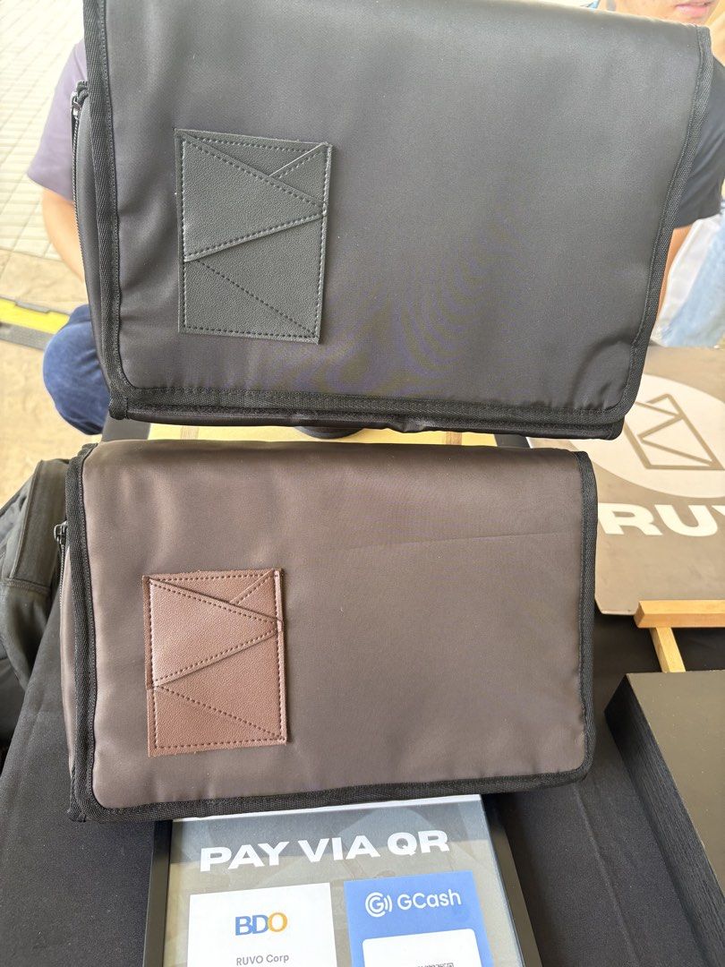 RUVO Organizer Bag Black and Brown (Category: Luxury Bags & Wallets) located in Pasay City. Submitted by enzopeco (Listing ID 1469410026, Image 1). Description: - Set of 2 organizer bags (1 black, 1 brown) - Structured rectangular design with all-around zipper closure - Sturdy build with clean fabric material and front accent panel - Ideal for daily utility, travel essentials, or document storage - Selling individually 1100 per pc.