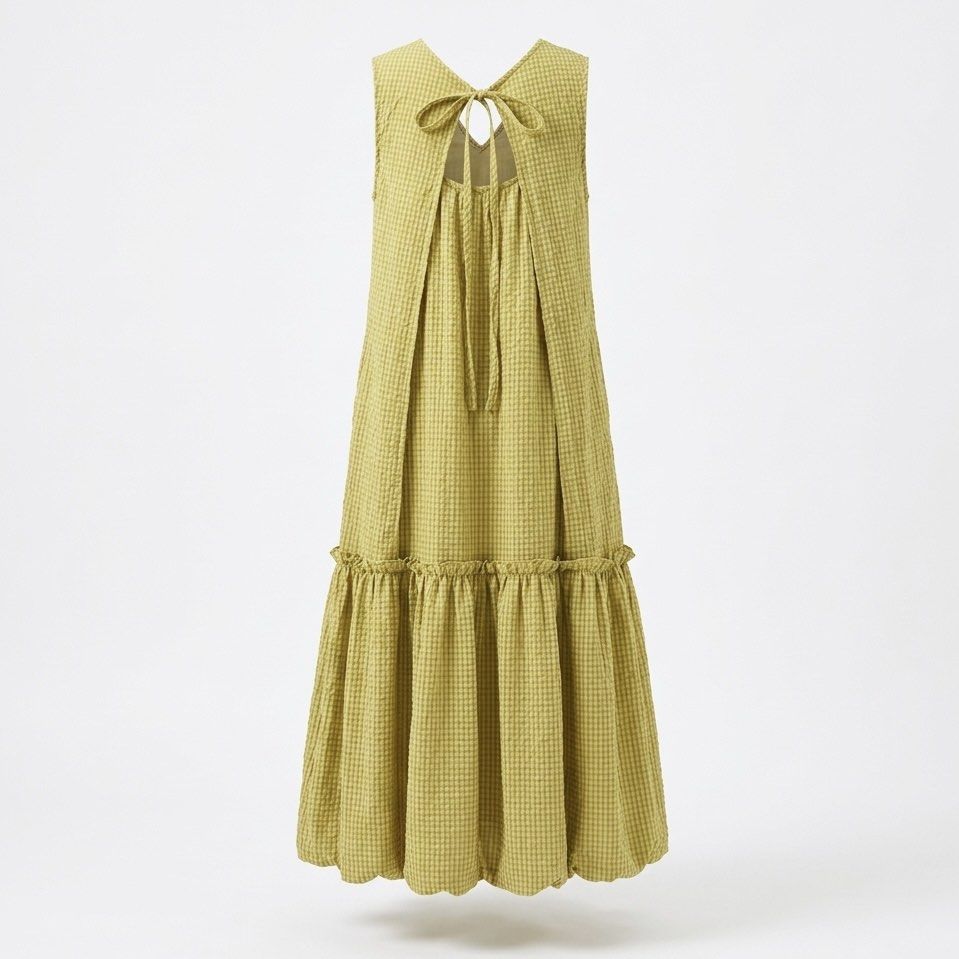 Chartreuse Checkered Sleeveless Balloon Hem Dress (Category: Dresses) located in General Trias. Submitted by dearsunnyshine (Listing ID 1469487149, Image 2). Description: - Color: Sage green with subtle checkered texture - Style: Sleeveless midi dress with drop-waist and voluminous bubble hem - Details: Front button placket with white pearl buttons, adjustable back necktie bow - Fabric: Lightweight woven material, easy slip-on fit - Condition: Br