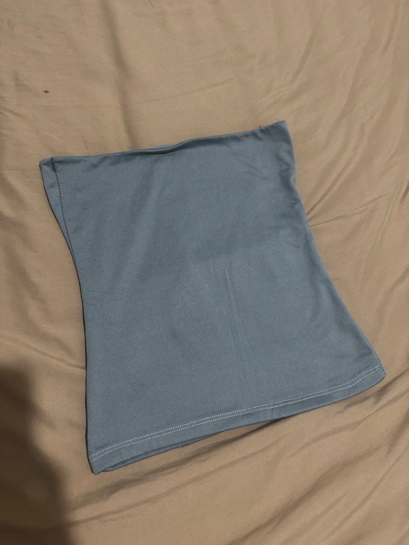 Light blue Tube Top (Category: Sleeveless) located in Makati City. Submitted by danittt (Listing ID 1469533534, Image 2). Description: - Color: light blue - Style: Minimalist tube top - Fit: Stretchy and snug - Condition: Worn once, excellent shape - Features: Clean stitching at the hem - Versatility: Perfect to pair with high-waisted jeans or skirts for casual days or night outs.