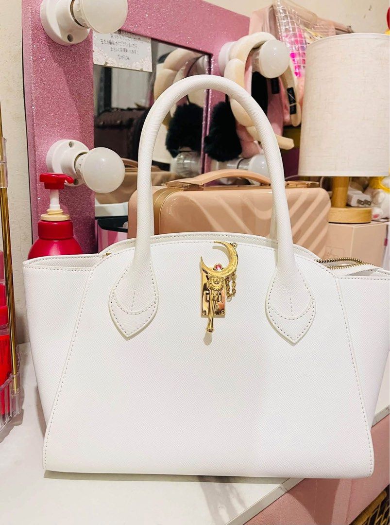 Samantha Vega Sailor Moon bag (Category: Tote Bags) located in Davao. Submitted by princesss_preloved (Listing ID 1469484564, Image 1). Description: Samantha Vega Sailor Moon bag in white Small size Guaranteed 💯 AUTHENTIC from Isetan Japan! This is a preloved item, aside from slight signs of use..there are no major or noticeable flaws. Interior lining is clean. No scruffs. Leather smells good still. Used only four times maybe less. Pls note that