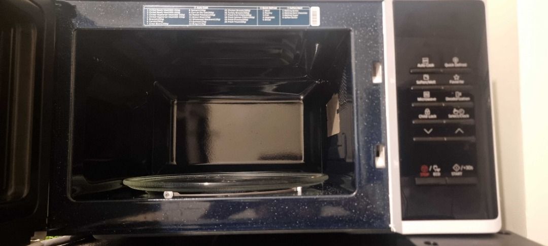 Samsung Ceramic Microwave Oven (Category: Ovens & Toasters) located in Caloocan City. Submitted by karl_samera1202 (Listing ID 1469497795, Image 3). Description: - Brand: Samsung countertop microwave - Design: Sleek black glass door with digital control panel - Interior: Clean, durable ceramic cavity for easy cleaning - Features: Multiple preset cooking and heating buttons - Included: Glass turntable tray - Condition: Works great, perfect for dai