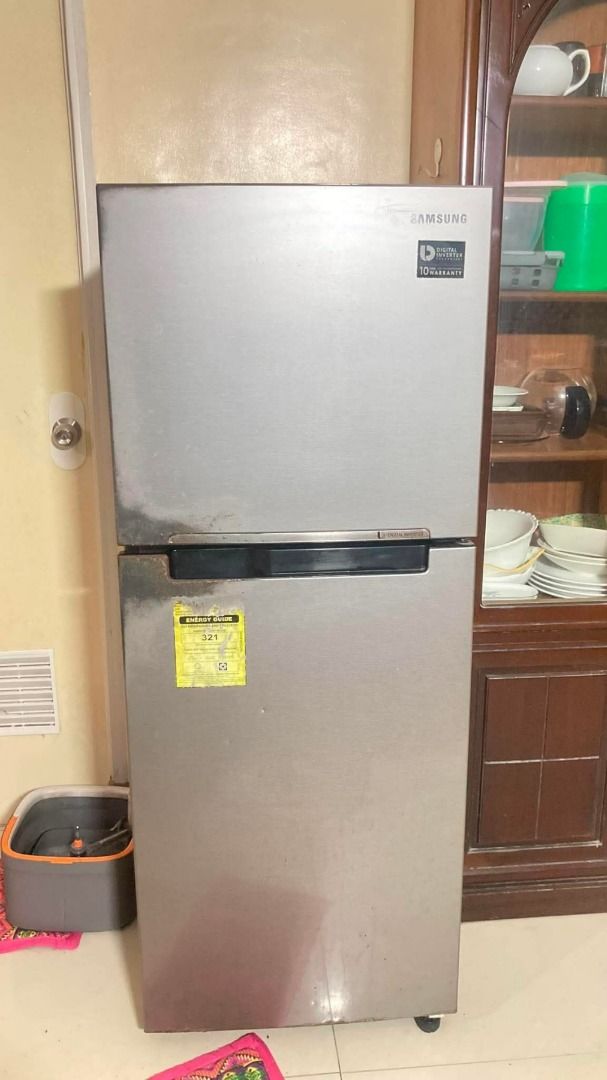 SAMSUNG REFRIGERATOR (Category: Refrigerators and Freezers) located in Caloocan City. Submitted by oddphoenix.b81bbe (Listing ID 1469419404, Image 2). Description: - Brand: Samsung double door refrigerator - Color/Finish: Sleek silver stainless steel - Freezer: Top freezer with Ice Max 2x tray setup - Storage: Fresh Room, adjustable glass shelving, and a large bottom crisper drawer for fruits and vegetables - Efficiency: Digital inverter compress