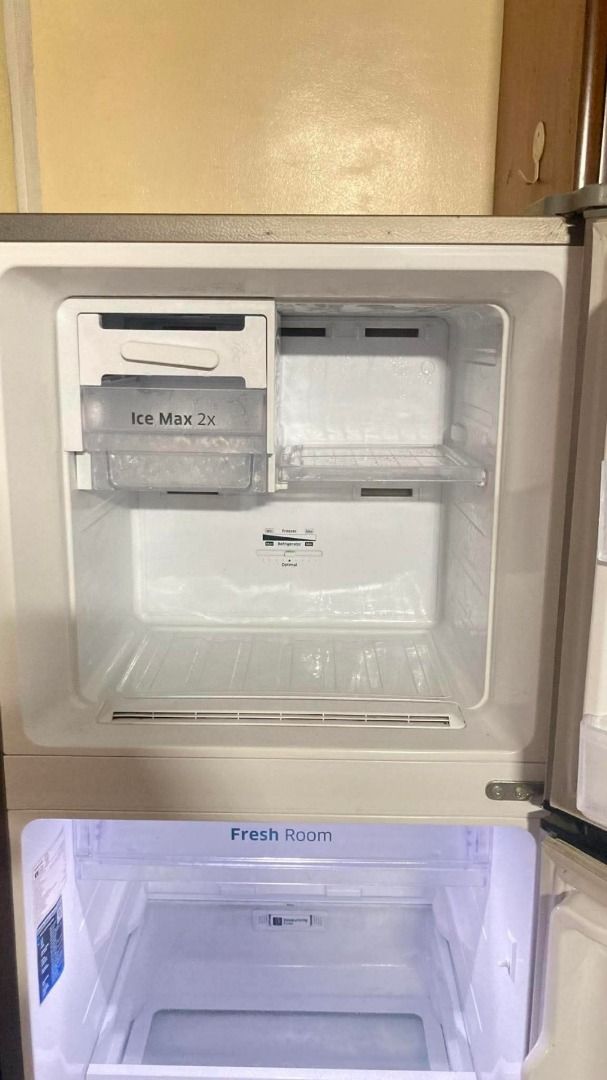 SAMSUNG REFRIGERATOR (Category: Refrigerators and Freezers) located in Caloocan City. Submitted by oddphoenix.b81bbe (Listing ID 1469419404, Image 3). Description: - Brand: Samsung double door refrigerator - Color/Finish: Sleek silver stainless steel - Freezer: Top freezer with Ice Max 2x tray setup - Storage: Fresh Room, adjustable glass shelving, and a large bottom crisper drawer for fruits and vegetables - Efficiency: Digital inverter compress