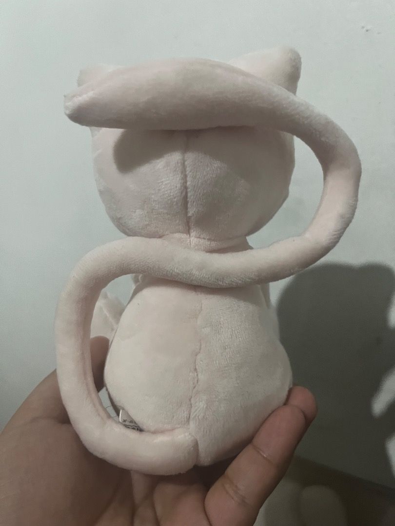 San-Ei Pokémon Mew Plush (Category: Plushies & Soft Toys) located in Tarlac. Submitted by theoshawott_adventureph (Listing ID 1469513143, Image 2). Description: - Authentic San-Ei Pokémon Mew plushie with official tag attached - Model: X41026 - Super soft pink fabric with detailed embroidered blue eyes and curled tail - Meetup or shipping options available across the Philippines.