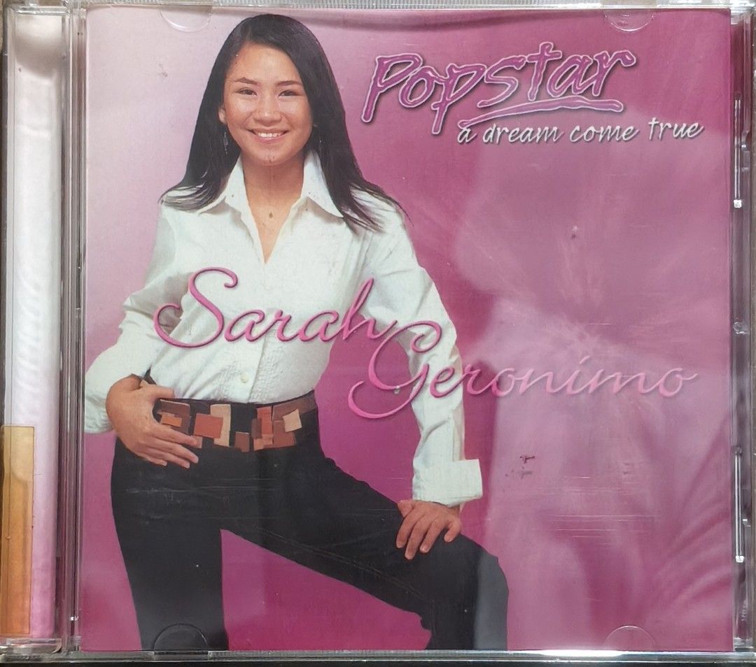 Sarah Geronimo - Popstar: A Dream Come True CD (Category: CDs & DVDs) located in Manila. Submitted by ruelcabrer77078 (Listing ID 1469554769, Image 1). Description: - Artist & Album: Sarah Geronimo - Popstar A Dream Come True - Release Year & Label: 2003, Viva Records - Tracklist: 15 tracks including 'Just Believe', 'If Only', and 'Twin Hearts' - Inclusions: Standard jewel case, original booklet, and CD - Condition: Good working condition, with h