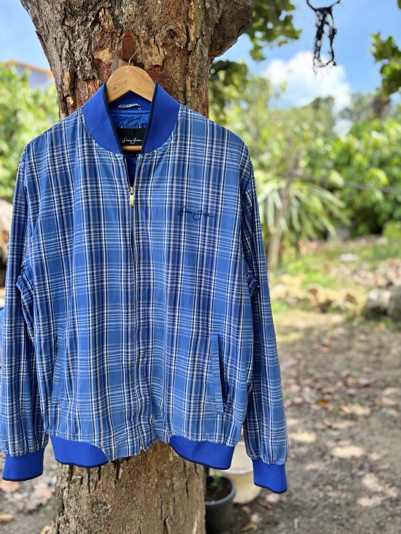 Sean John Blue Plaid Bomber Jacket Size L (Category: Coats, Jackets and Outerwear) located in San Jacinto. Submitted by ticao_thrift (Listing ID 1469571807, Image 2). Description: - Brand: Sean John - Size: L - Style: Blue plaid bomber jacket with zip-up front - Details: Signature embroidered logo on chest, deep blue smooth inner lining, and front hand pockets - Fit: Comfortable fit, ribbed collar, cuffs, and hem - Condition: Great vintage street