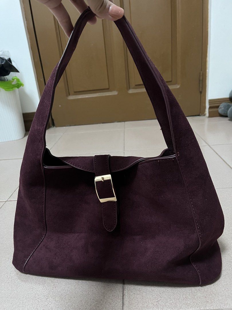 Secosana Alba Maroon Suede Hobo Medium Bag (Category: Shoulder Bags) located in Antipolo. Submitted by declutter.clothes (Listing ID 1469568060, Image 2). Description: - Brand: Secosana - Color: Deep Maroon - Material: Suede with gold-tone hardware - Closure: Front buckle strap - Condition: Like new, used for a few times only - Bought for 690 in orange app.
