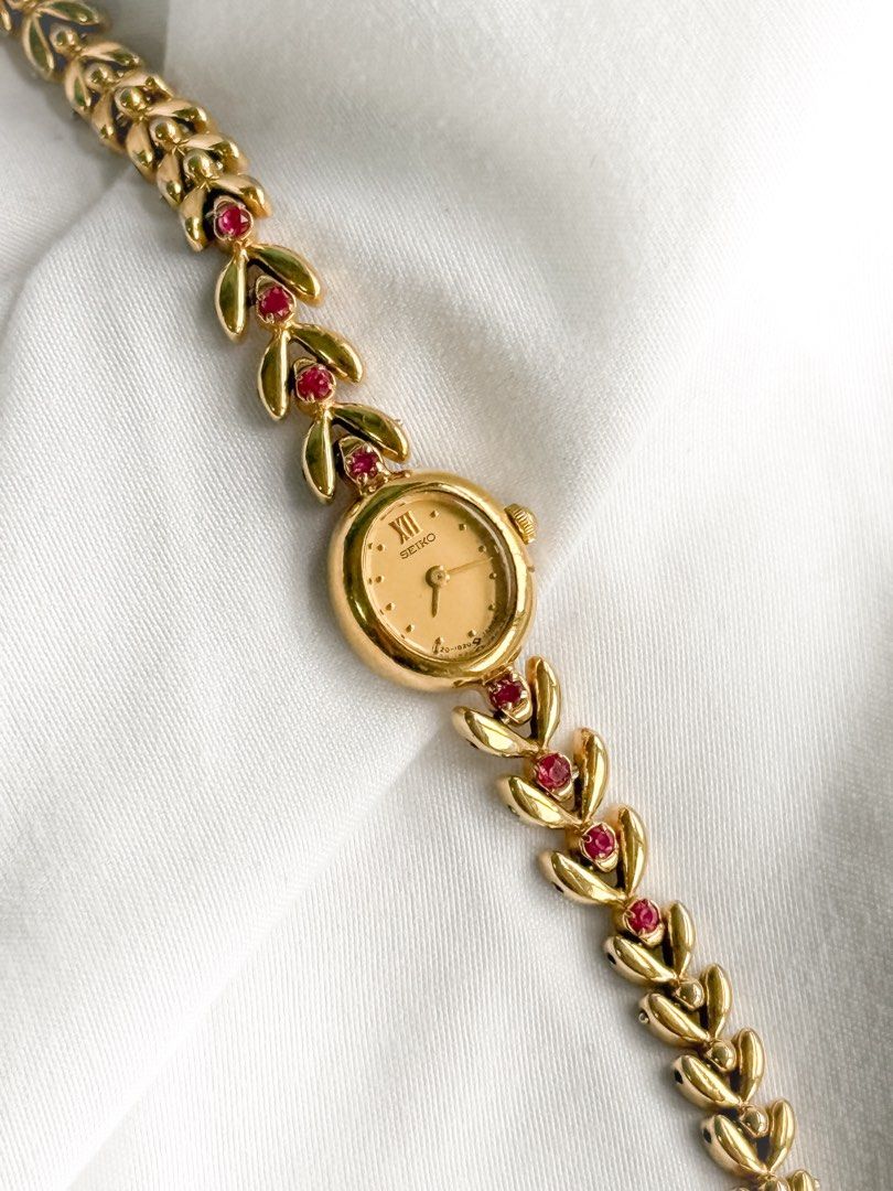Seiko 1E20 Ruby Leaf Watch (Category: Women's Watches) located in Santo Tomas. Submitted by elegante07 (Listing ID 1469472762, Image 2). Description: (SUPER RARE) Seiko 1E20 Ruby Leaf Watch Details: * Good and in working condition ✨ * Dents on right side of the face but not that noticeable when worn * Beautiful combination of rubies and gold leaf shaped bracelet * Minimal fading on end parts of strap * Part of 1E20 line * Model hard to come-by * 