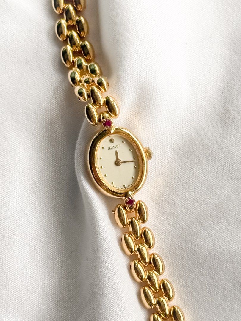 Seiko 1E20 Ruby Oval Watch (Category: Women's Watches) located in Santo Tomas. Submitted by elegante07 (Listing ID 1469472327, Image 2). Description: (RARE) Seiko 1E20 Ruby Oval Watch Details: * Excellent and in working condition ✨ * Model hard to come-by * Newly Electro-plated 😍 * 21 mm x 17 mm Case Diameter * Adjustable Strap! Fits wrist (approx. 17 cm) * Quartz Movement * Hairline scratches on glass (not noticeable when worn) Includes: 🤎 New