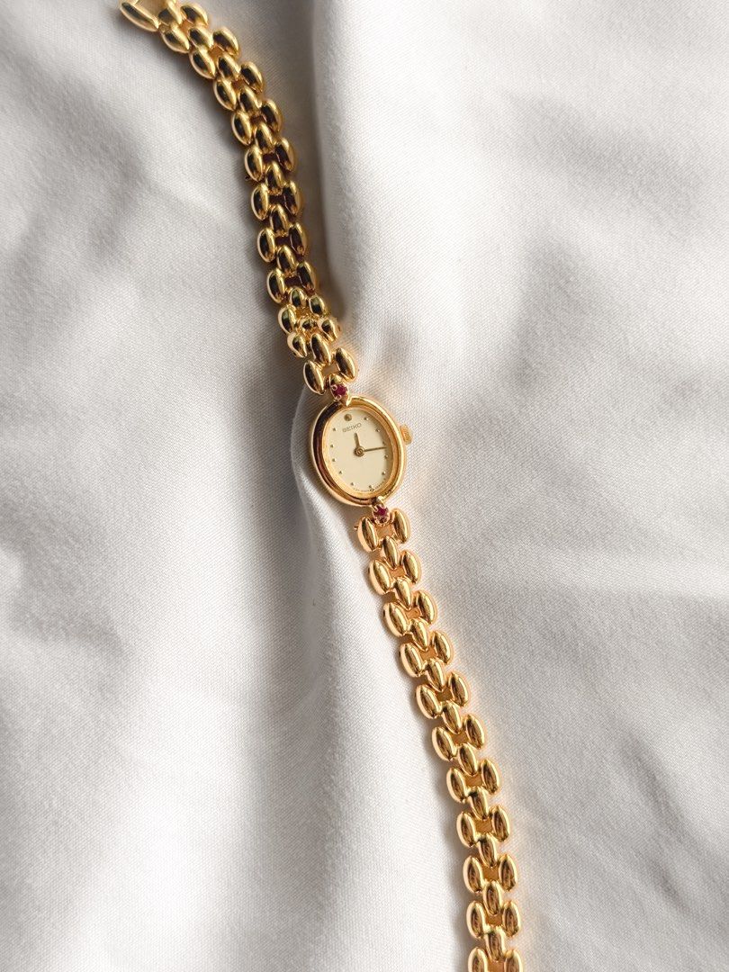 Seiko 1E20 Ruby Oval Watch (Category: Women's Watches) located in Santo Tomas. Submitted by elegante07 (Listing ID 1469472327, Image 3). Description: (RARE) Seiko 1E20 Ruby Oval Watch Details: * Excellent and in working condition ✨ * Model hard to come-by * Newly Electro-plated 😍 * 21 mm x 17 mm Case Diameter * Adjustable Strap! Fits wrist (approx. 17 cm) * Quartz Movement * Hairline scratches on glass (not noticeable when worn) Includes: 🤎 New
