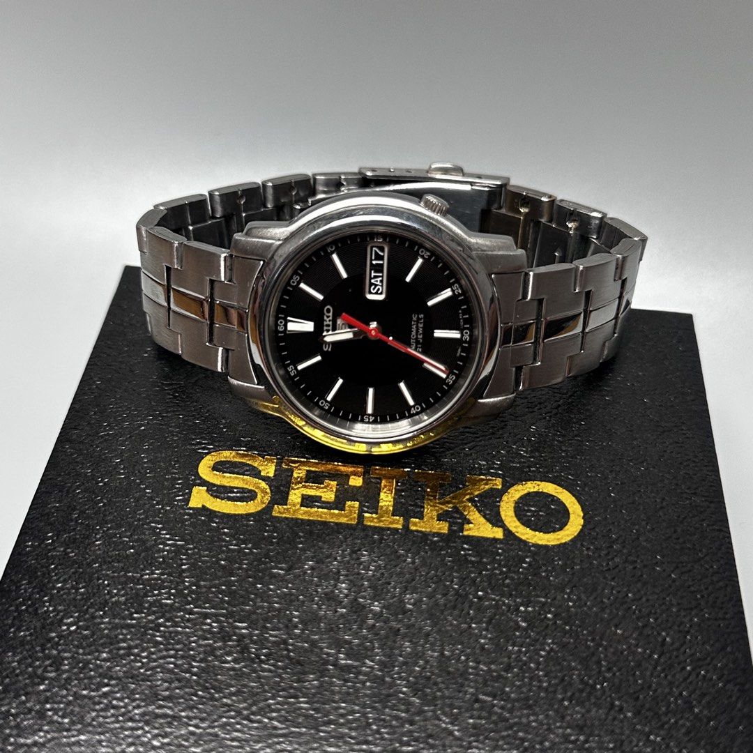 SEIKO 5 AUTOMATIC (Category: Men's Watches) located in Baguio. Submitted by subaitems (Listing ID 1469457650, Image 2). Description: SEIKO 5 "SNKL83" Classic Black Dial ⌚️ Luminous Hour marker and hands Details: • Original Seiko watch • Day-date window quickset • 7s26 Automatic movement • Approximately 37mm diameter • Can fit up to 7 to 7.5 inch wrist • Running in good condition • Original parts and bracelet • No issue, even in the dial & hands N