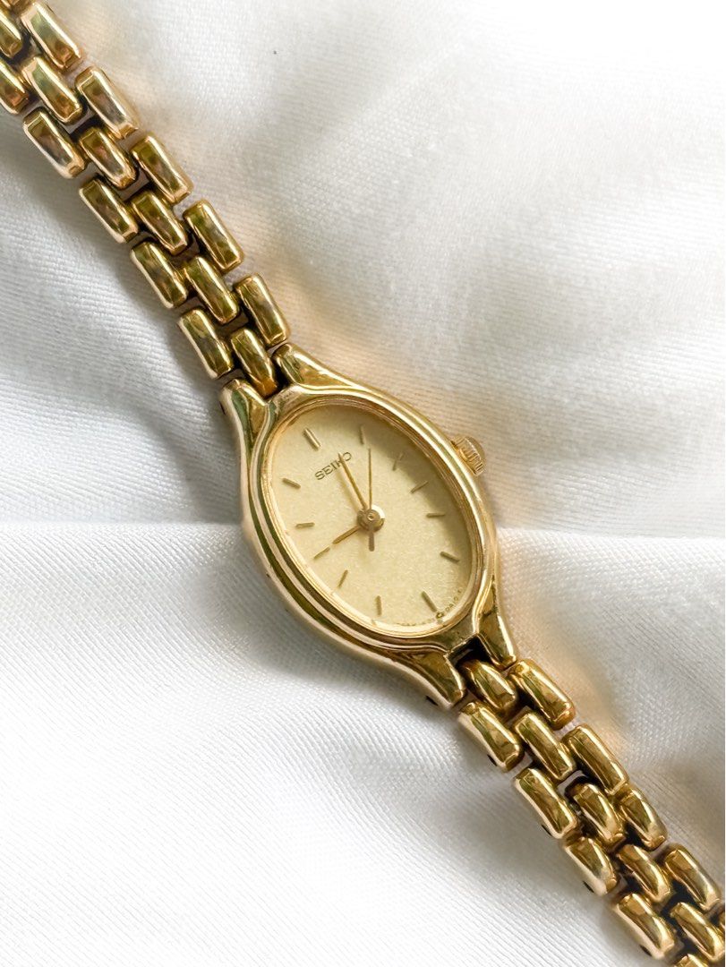 Seiko Mini Oval Watch in Gold (Category: Women's Watches) located in Santo Tomas. Submitted by elegante07 (Listing ID 1469482557, Image 3). Description: Gold Mini Oval Seiko Vintage Watch Details: * ONE OF THE MOST versatile vintage pieces * Good condition * Has some fadings of gold plating, including in the inside part of bracelet * One of the sought after seiko vintage models * Hairline scratches on glass part (not noticeable when worn and with